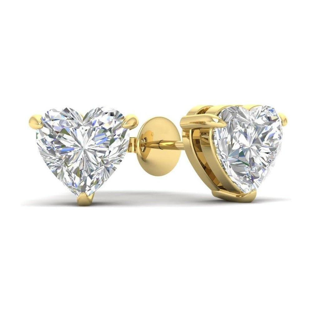Heart-shaped moissanite diamond earrings with gold prongs on a white background