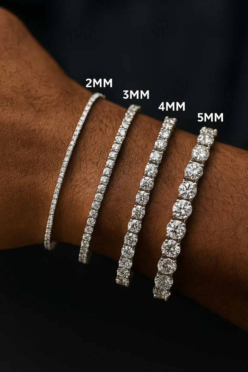 Four diamond bracelets of different widths on a wrist with labeled measurements against a dark background.