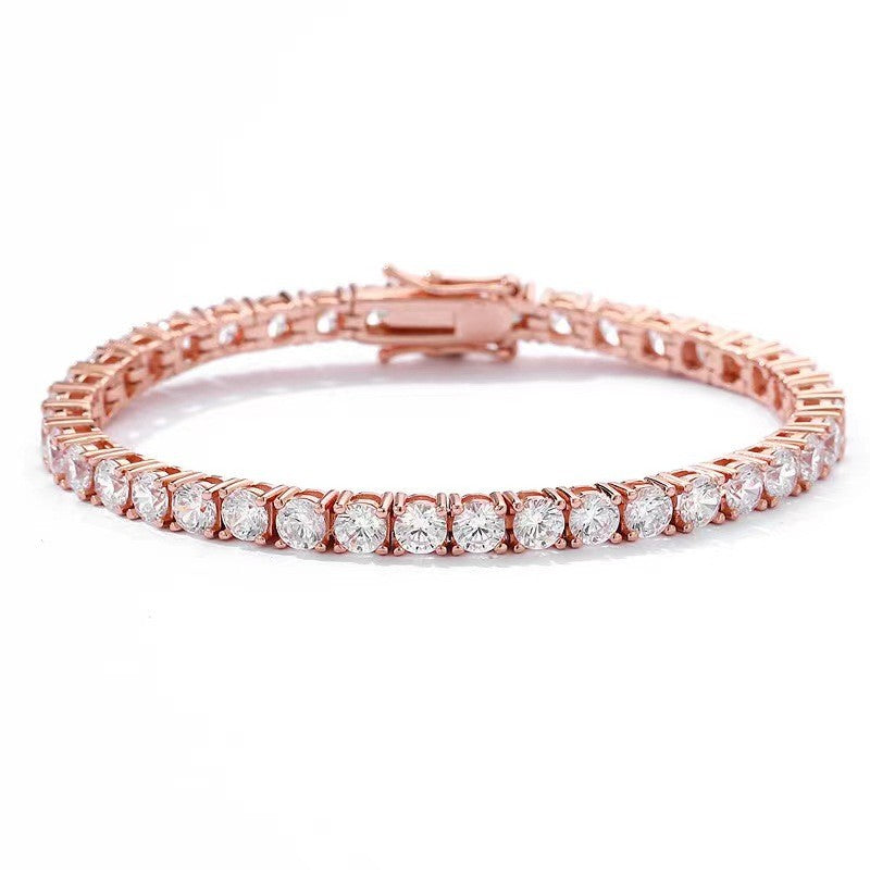 Rose gold bracelet with clear gemstones on a white background