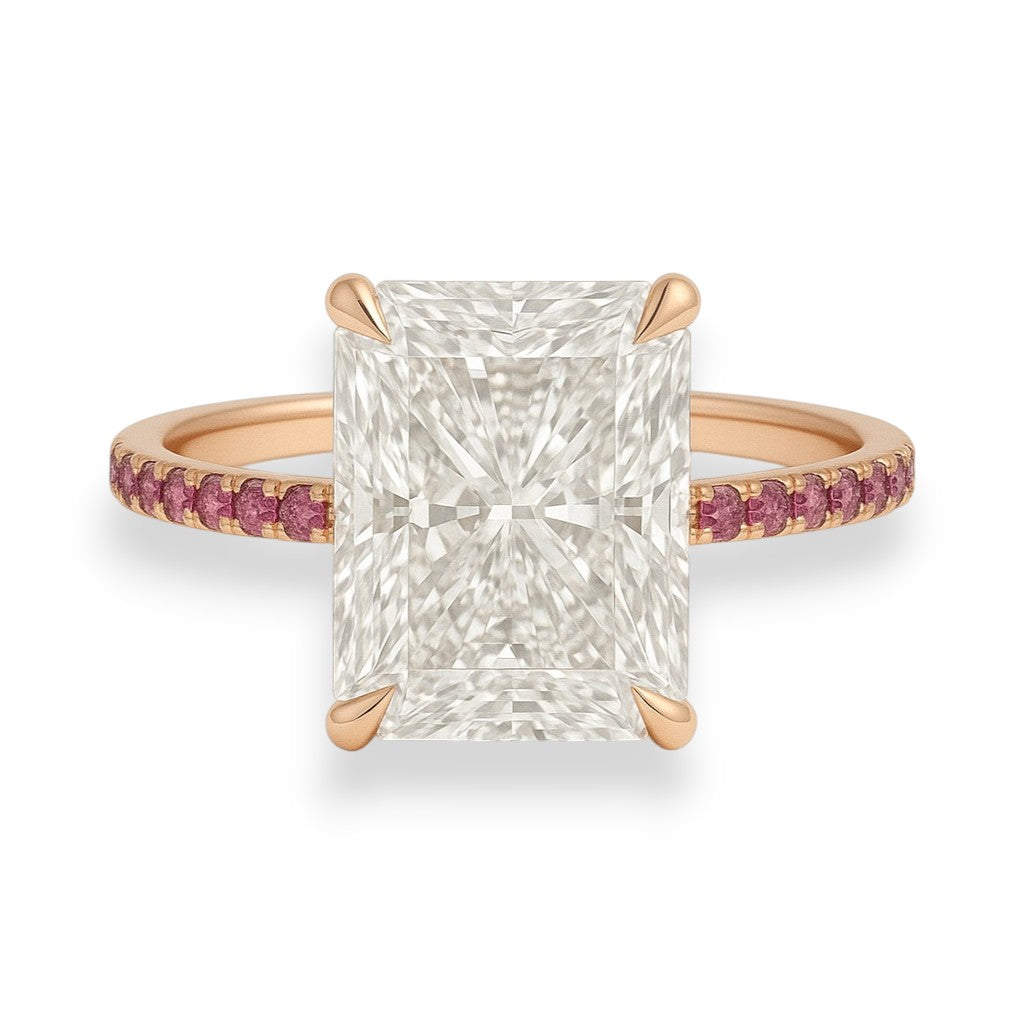 Rose gold ring with a large diamond and smaller pink gemstones on a white background. 5.2ct Radiant Cut Crushed Ice Moissanite Pink Sapphire Engagement Ring