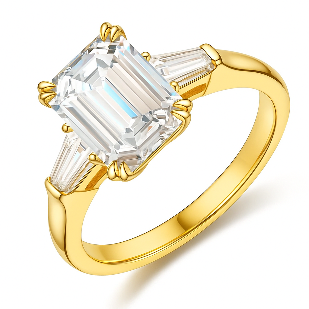 Gold ring with a large emerald-cut diamond and smaller baguette diamonds on a white background