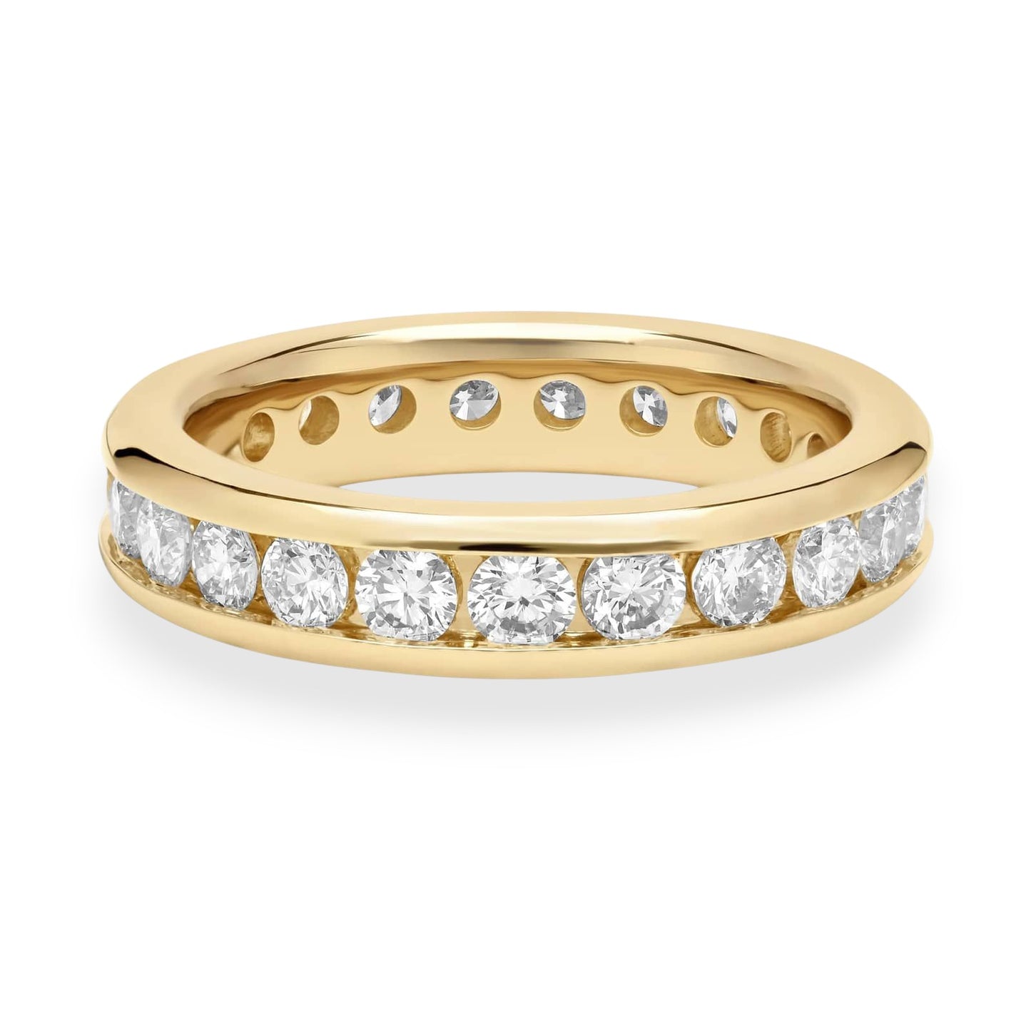 Gold ring with embedded diamonds on a white background. Classic 18K yellow gold eternity band with channel-set moissanite. Sleek, secure, and endlessly elegant.