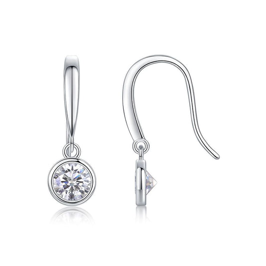 Silver earrings with clear gemstones on a white background