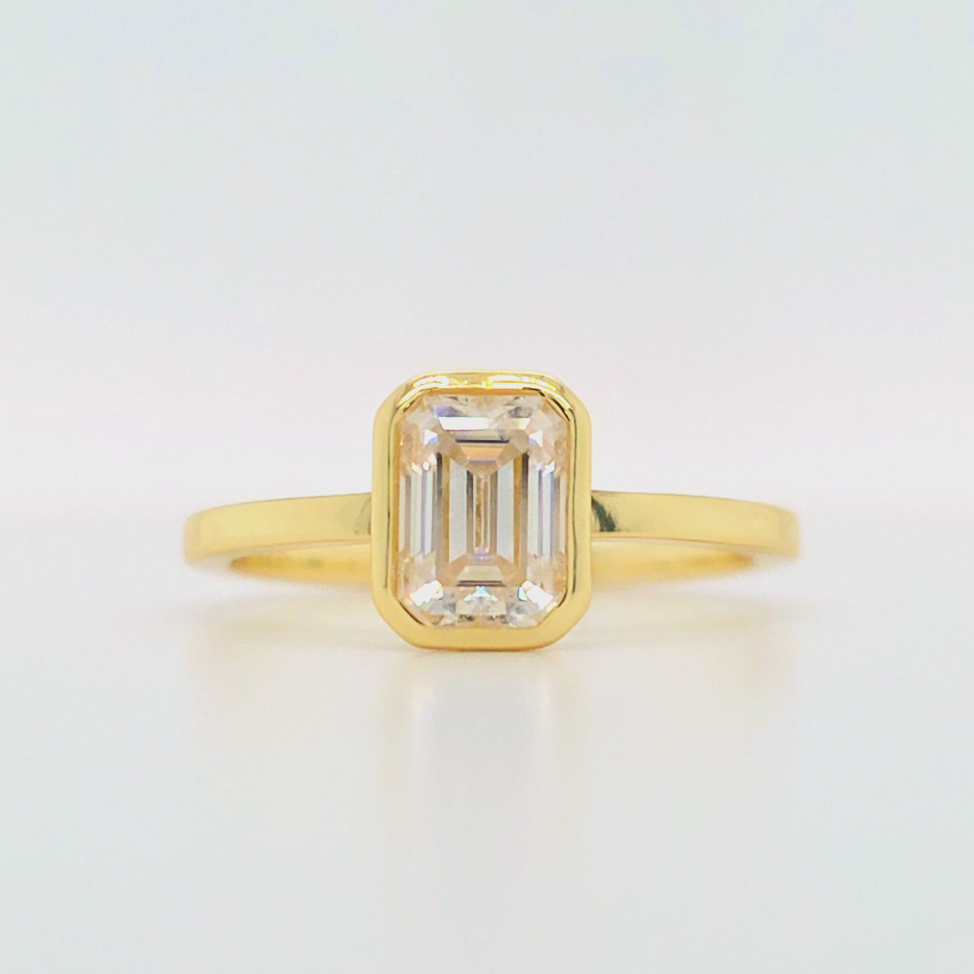 1 carat emerald cut moissanite engagement ring with bezel setting in gold-plated silver – ethical diamond alternative Australia, handcrafted