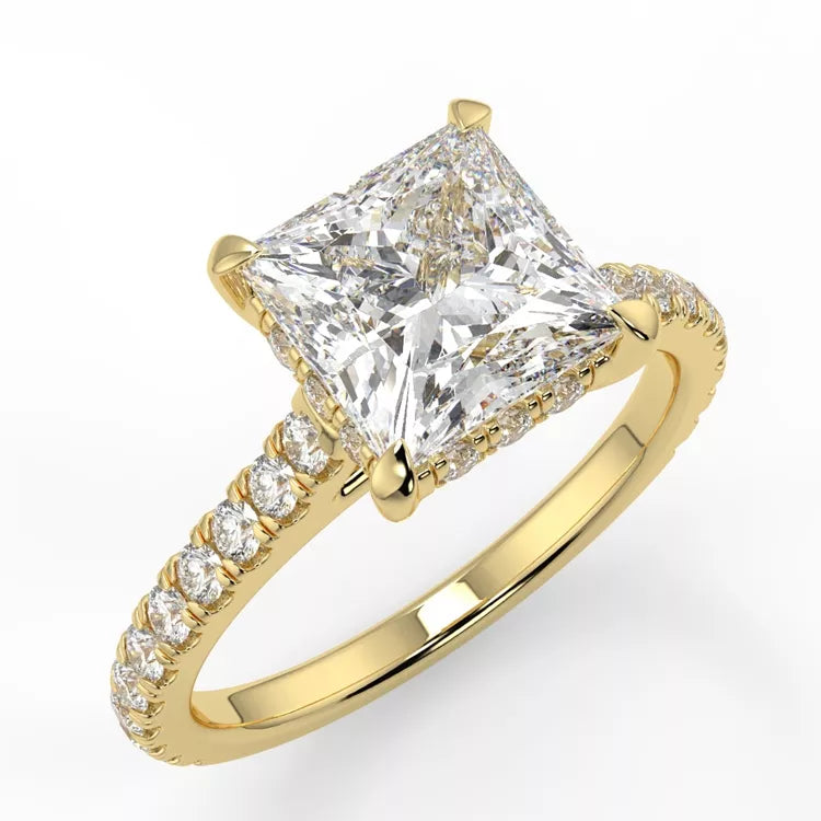 A gold band with a princess cut moissanite solitaire ring, featuring a hidden halo and pave band.