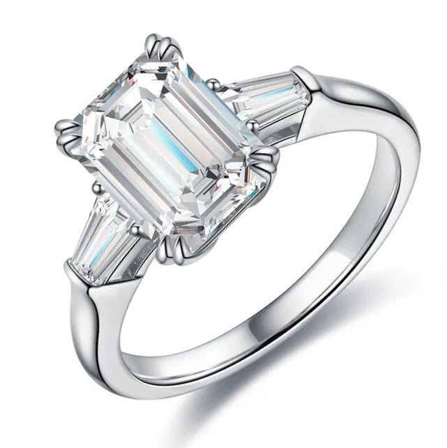 Emerald cut moissanite ring with baguette side stones. A timeless engagement ring in yellow gold. Ethical moissanite jewellery Australia.