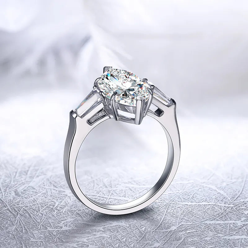 Marquise moissanite engagement ring with baguette side stones. Art deco style in yellow gold. Moissanite rings Sydney. Ethical bridal jewellery.