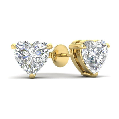 Heart-shaped moissanite diamond earrings with gold prongs on a white background