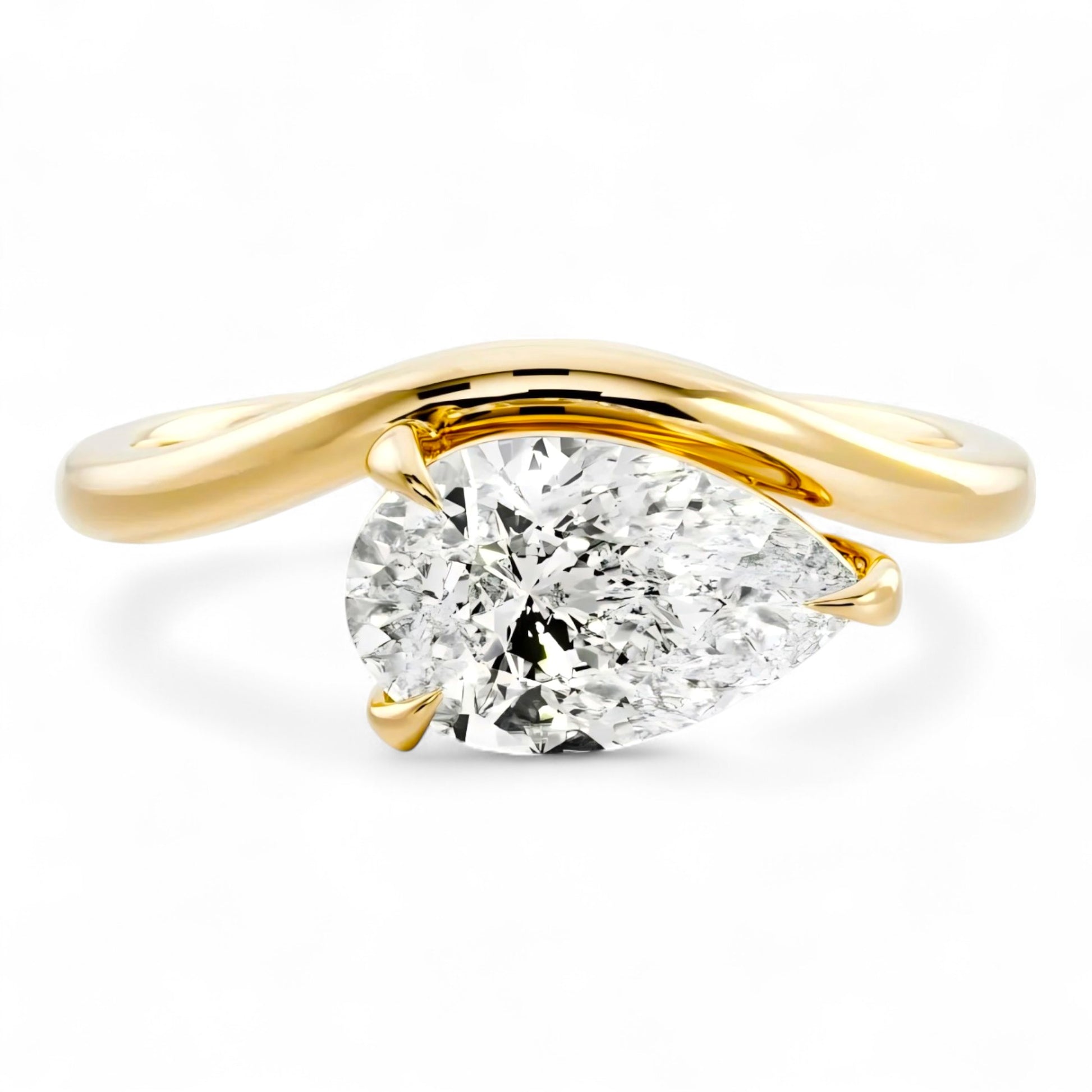 2 carat pear moissanite engagement ring in curved yellow gold setting. Sculptural and ethical. Moissanite rings Australia for modern brides.