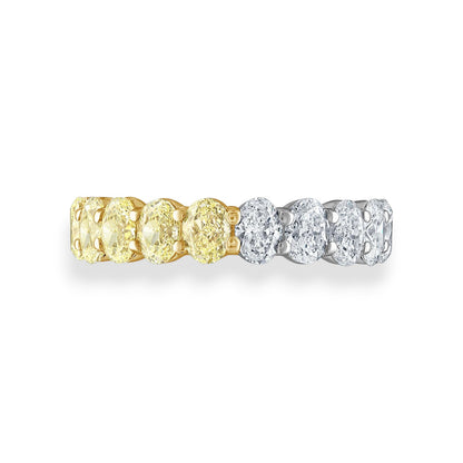 Two diamond rings, one gold and one silver, on a white background