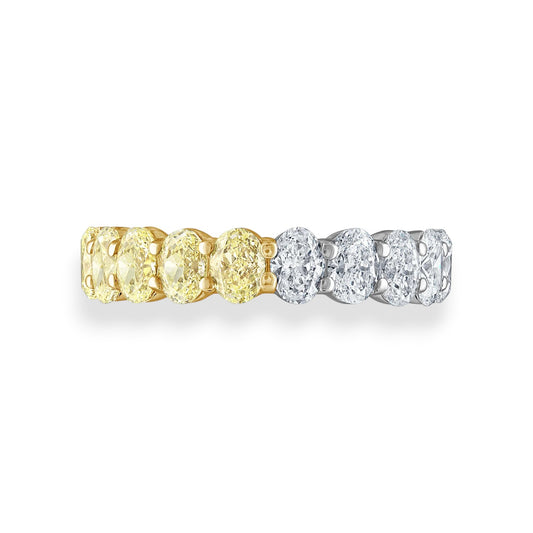 Two diamond rings, one gold and one silver, on a white background