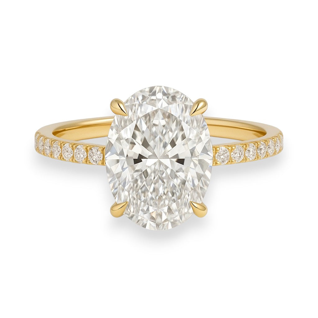 Gold ring with a large diamond and smaller diamonds on the band against a white background. 4.7ct Oval Cut Crushed Ice Moissanite Solitaire Engagement Ring