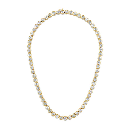 Gold necklace with clear stones on a white background