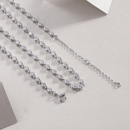 Bezel-set moissanite tennis necklace in gold, round brilliant stones in full circle design. Ethical diamond alternative. Moissanite jewellery Australia