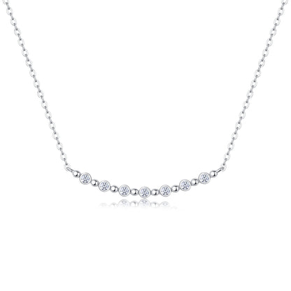 Silver necklace with small round diamonds on a white background