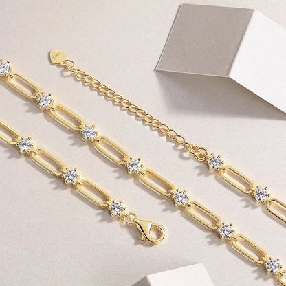 Alternating open gold-plated links and round standard moissanite necklace