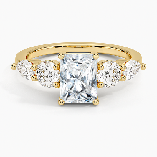 Gold ring with a central square-cut diamond and three smaller round diamonds on a white background. Radiant Five Stone Moissanite Ring