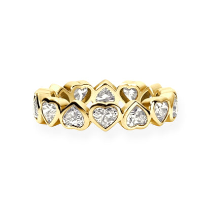 Gold ring with heart-shaped diamond stones on a white background.
