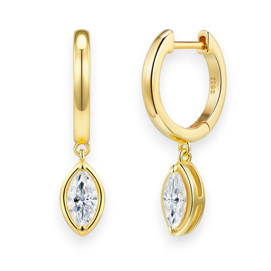 Gold hoop earrings with diamond-like stones on a white background