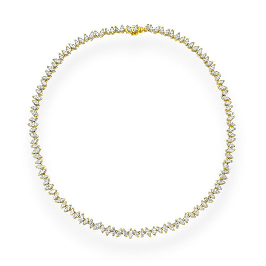 Gold necklace with clear stones on a white background. Marquise Cut Moissanite Tennis Necklace in 18K Yellow Gold