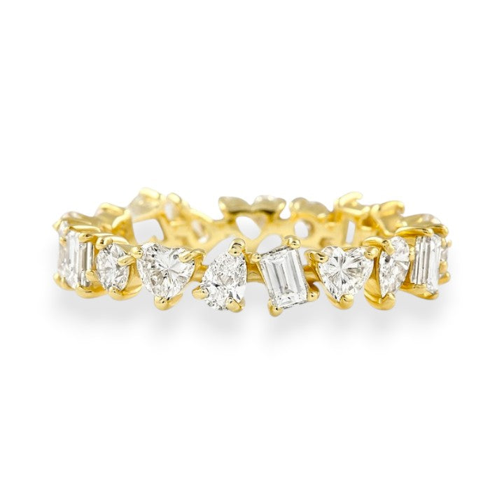 Gold ring with diamond stones on a white background. Mixed Shape Moissanite Eternity Band