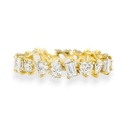 Gold ring with diamond stones on a white background. Mixed Shape Moissanite Eternity Band