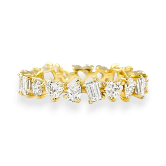 Gold ring with diamond stones on a white background. Mixed Shape Moissanite Eternity Band
