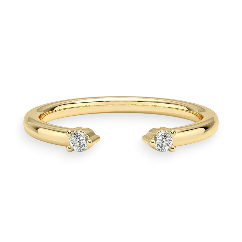 Gold ring with two diamond stones on a white background