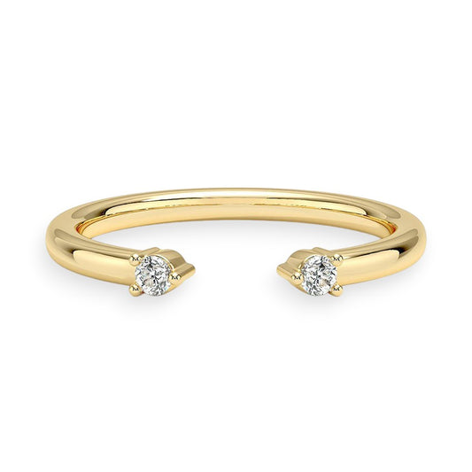 Gold ring with two diamond stones on a white background