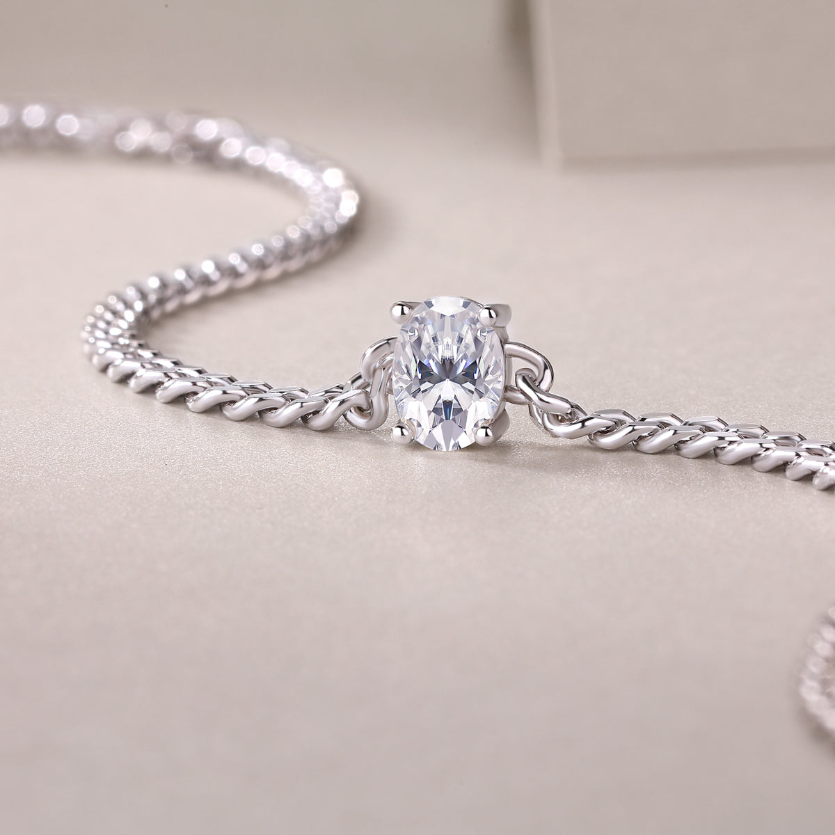 Rhodium-plated sterling silver moissanite bracelet with oval stone and curb chain. Ethical moissanite jewellery Australia, diamond alternative bracelet