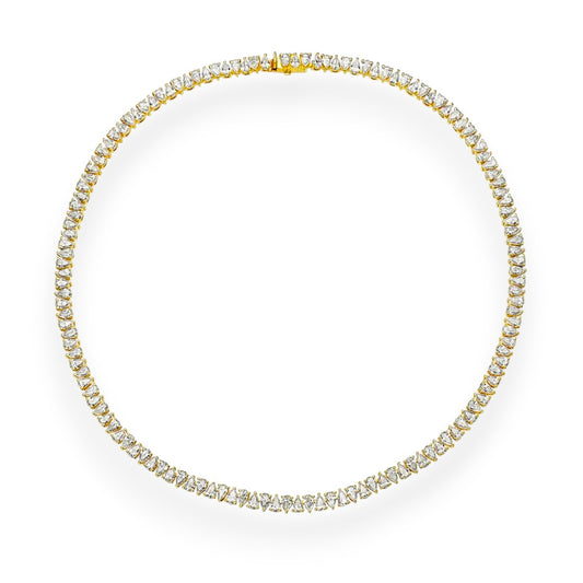 Gold necklace with diamonds on a white background. Elegant pear cut moissanite tennis necklace in 18K yellow gold. High-clarity, colourless stones for timeless sparkle.