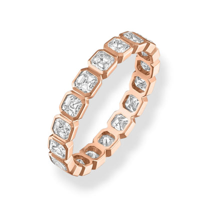 Rose gold ring with diamonds on a white background
