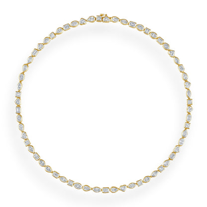 Gold necklace with clear stones on a white background