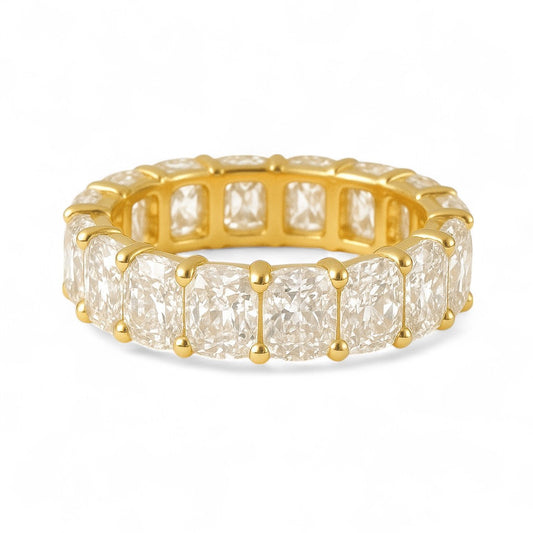 Gold ring with large diamonds on a white background