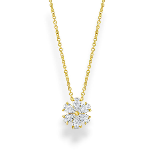 Gold necklace with a diamond flower pendant on a white background. Yellow gold moissanite flower pendant necklace with pear-cut petals and matching gold chain