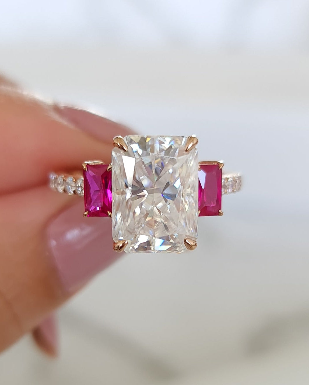 3.5 carat Radiant Cut Moissanite Trilogy Ring with Rubies