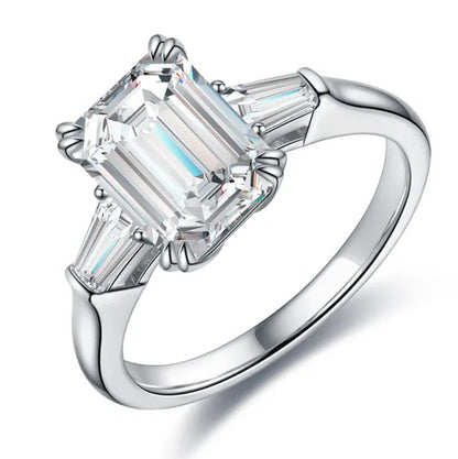 Emerald cut moissanite ring with baguette side stones. A timeless engagement ring in yellow gold. Ethical moissanite jewellery Australia.