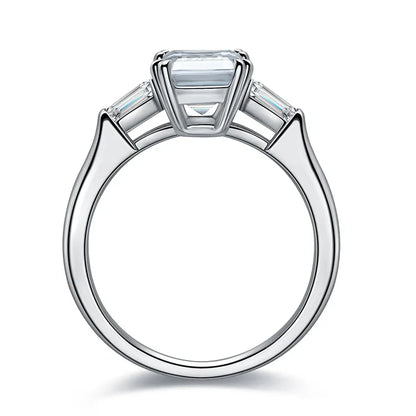 Emerald cut moissanite ring with baguette side stones. A timeless engagement ring in yellow gold. Ethical moissanite jewellery Australia.