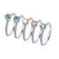Pink blue green white yellow 0.5 Carat Round Coloured Moissanite Ring on white backgroud
